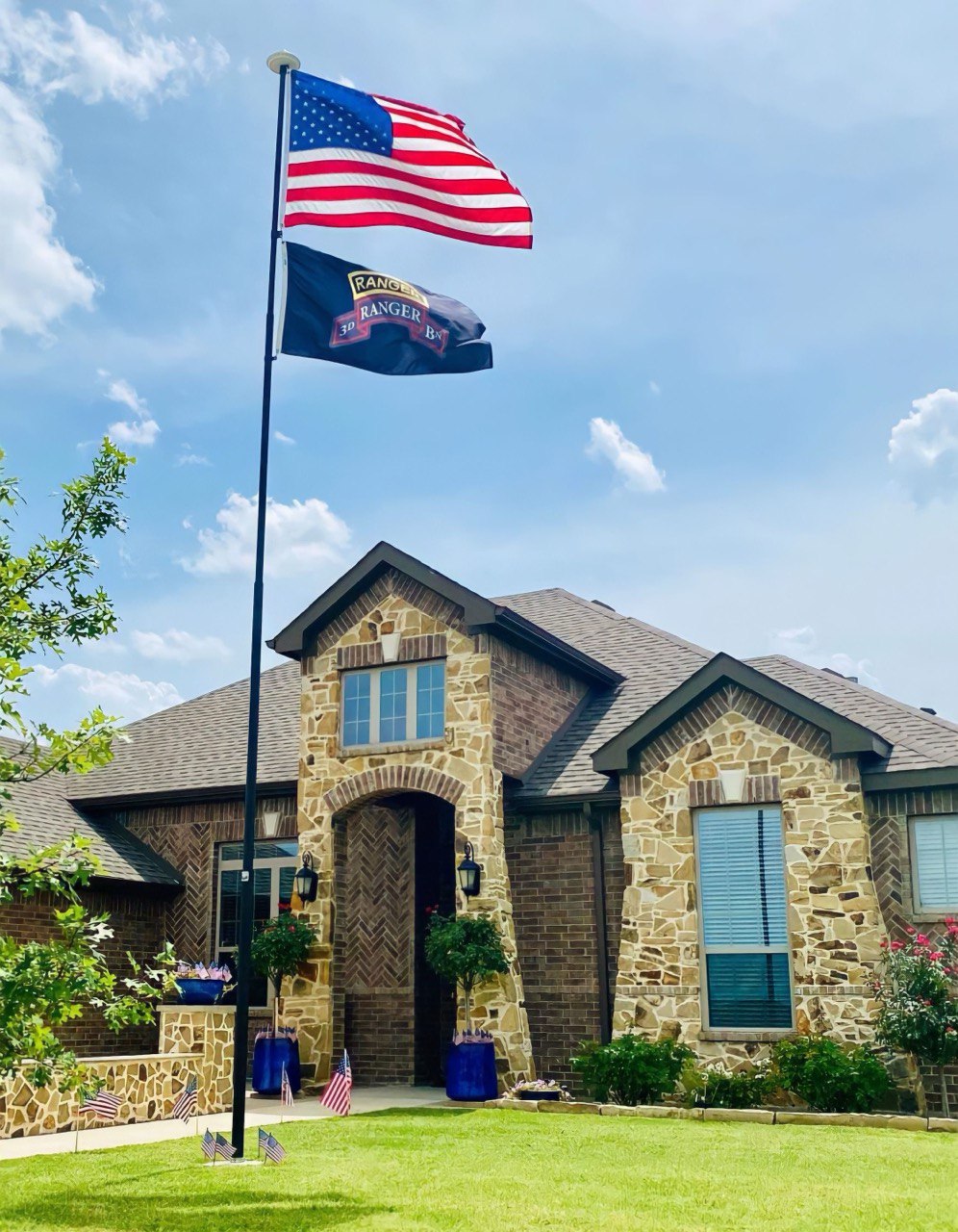 Family home with dual flag display