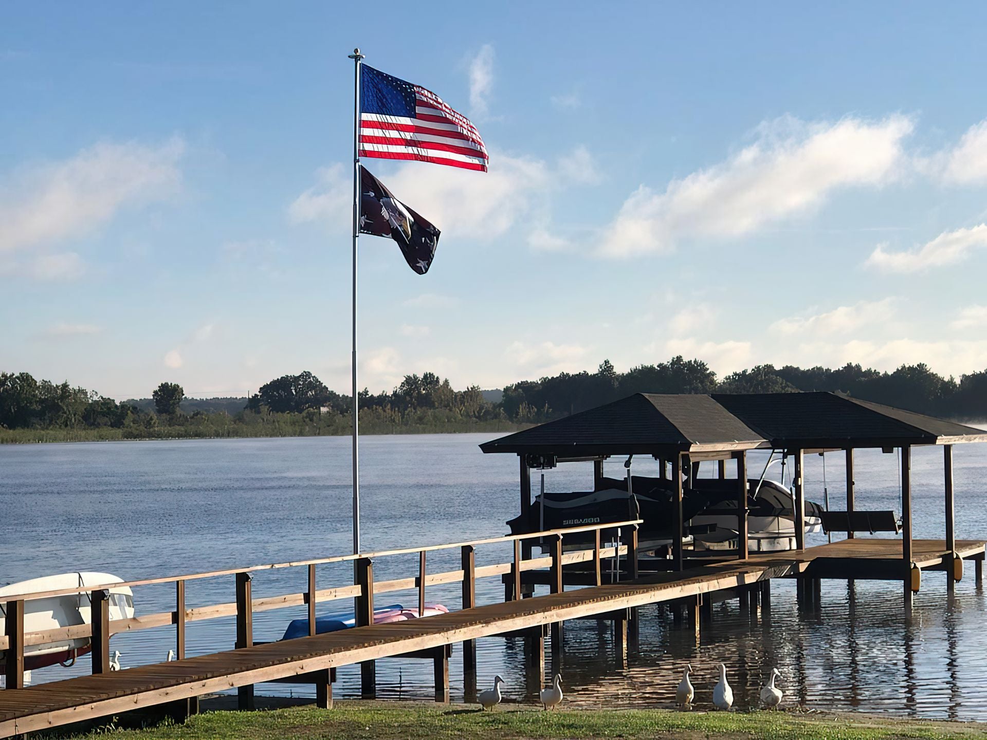 Phoenix flagpole flying the American flag at a customer home